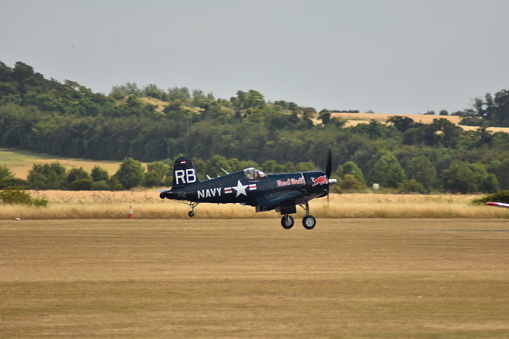 Duxford, UK - July 16, 2018. The Corsair was a carrier-based aircraft with folding gull wings. This example was built in 1945 and is operated by the Flying Bulls.