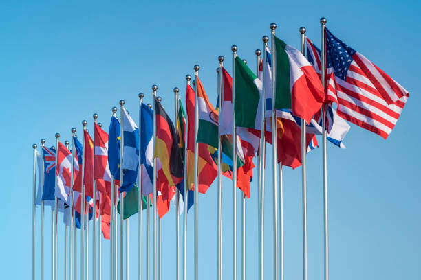 national flags national flags of various countries flying in the wind diplomacy stock pictures, royalty-free photos & images