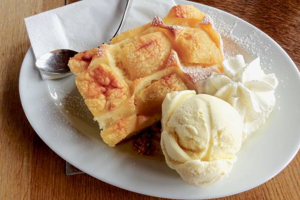 istock Afternoon apple cake with vanilla ice cream and whipped cream. 1023122564
