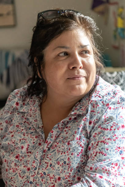 istock Smiling mature/senior woman looking away 1023125366