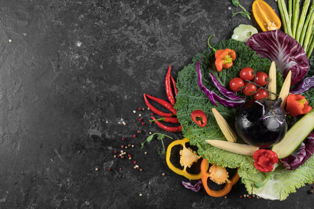 istock Food background. Fresh farmer vegetables at dark beton table. Space for text. 1023127460
