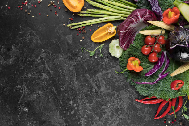istock Food background. Fresh farmer vegetables at dark beton table. Space for text. 1023127534