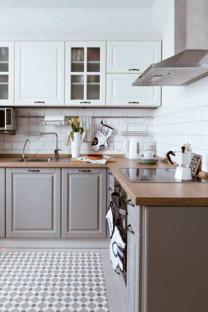 istock Scandinavian interior design. White grey kitchen room organization 1023127544