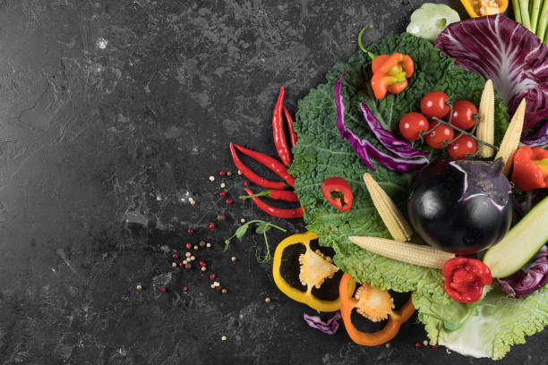 istock Food background. Fresh farmer vegetables at dark beton table. Space for text. 1023130948