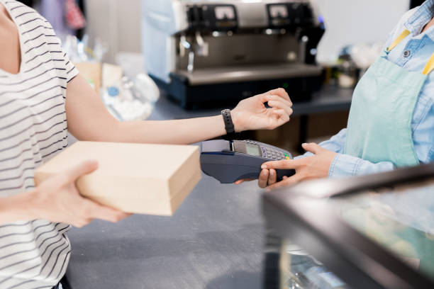 istock Woman Paying by NFC in Shop 1023139412