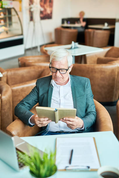 istock Senior Businessman Reading Book 1023140448