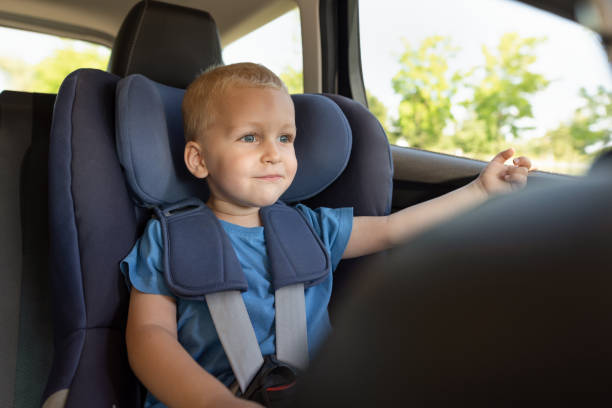 istock Joyful boy travels in a car seat 1023159948