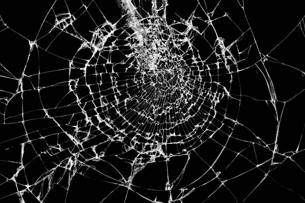 istock Broken glass isolated on black. Shattered glass background. 1023164512