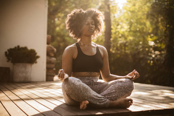 istock Practicing yoga outdoors 1023165518