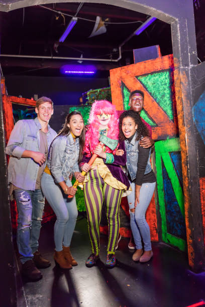 istock Multi-ethnic young adults in haunted house with zombie 1023182102