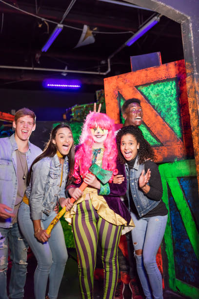 istock Multi-ethnic young adults in haunted house with zombie 1023182156