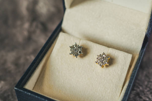 gold diamond earrings in jewelry box