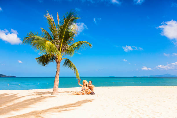 istock Family sitting at the beach 1023182328