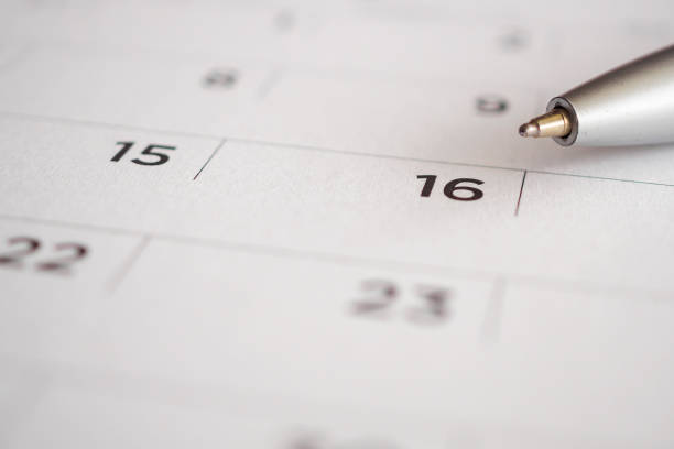 istock Calendar page with pen point at 16th date 1023182330