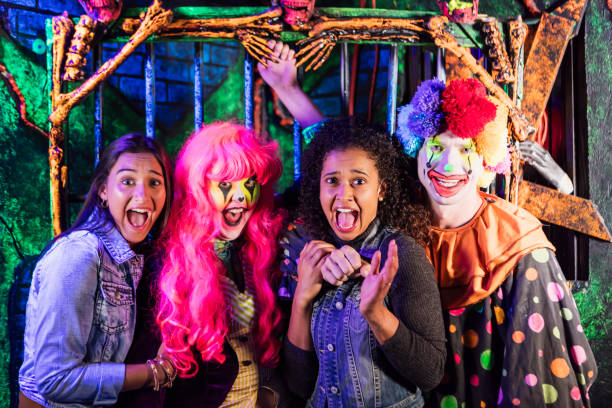 istock Zombie and clown in halloween haunted house 1023182562