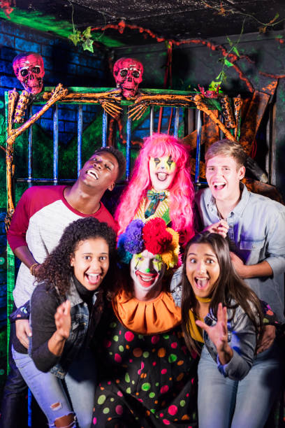 istock Friends having fun with zombies in haunted house 1023182564