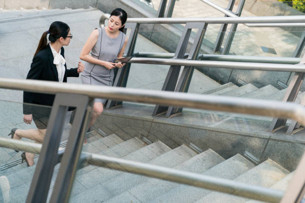 istock Office lady walking upstairs. 1023201822
