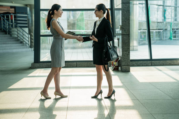 istock Office lady shaking hands in the company. 1023202088