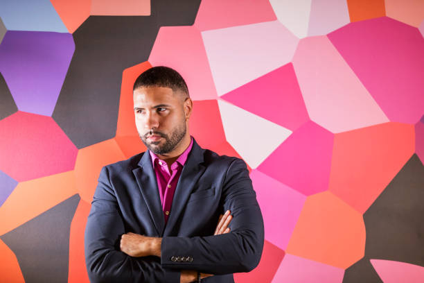 istock Mixed race man in front of wall with geometric pattern 1023204510