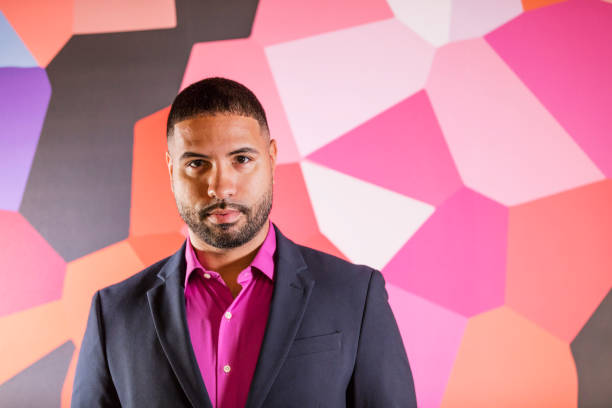 istock Mixed race man in front of wall with geometric pattern 1023204556