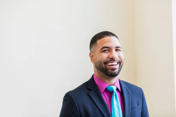 Mixed race man wearing a suit and tie