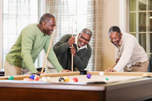 istock Three African-American men playing billiards 1023214310
