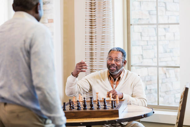 istock Mature African-American men playing chess 1023214406