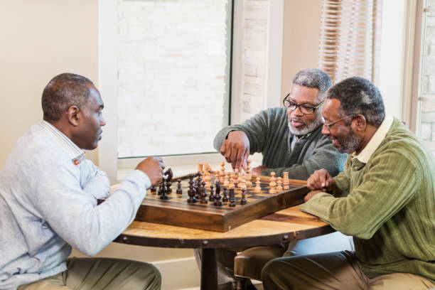 istock Three African-American men playing chess 1023214796