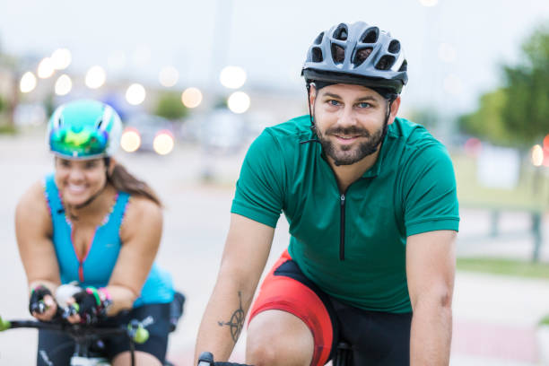 istock Young man enjoys biking with girlfriend 1023227130