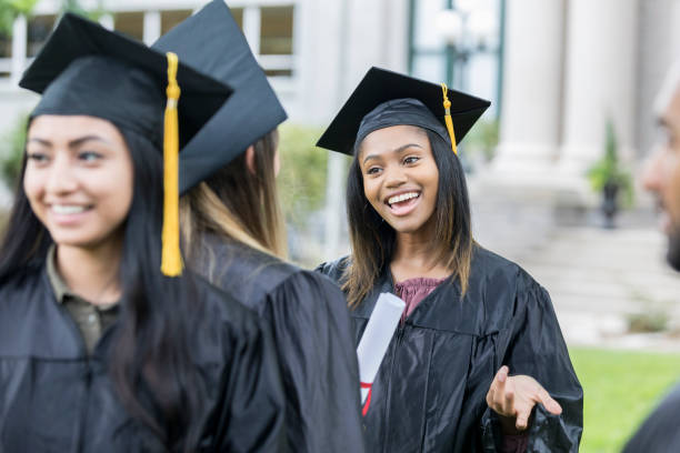 istock Happy college student talks with friend after graduation 1023227190