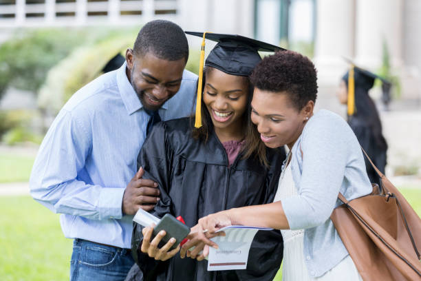 istock Cheerful college graduate taking selfie with parents 1023227222