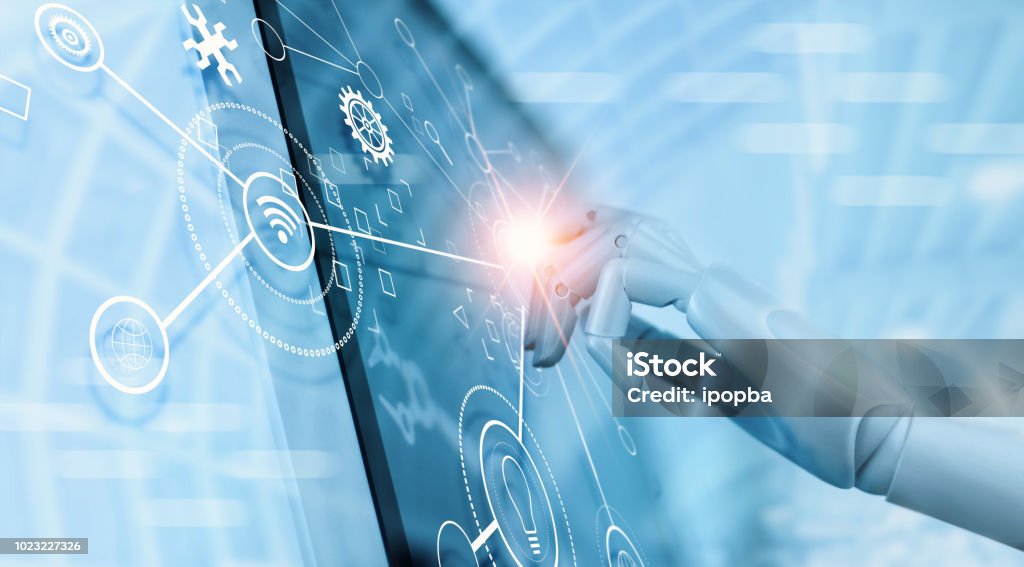 Hand of robot using over the interface virtual screen to check status and control automation robotics arms machine in intelligent factory industrial with icon flow and data exchange in manufacturing technology. AI. Futuristic technology and industry 4.0 c Hand of robot using over the interface virtual screen to check status and control automation robotics arms machine in intelligent factory industrial with icon flow and data exchange in manufacturing technology. AI. Futuristic technology and industry 4.0 concept. Automated Stock Photo