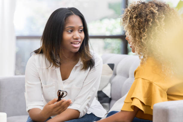 istock Young woman explaining something to her friend 1023229470