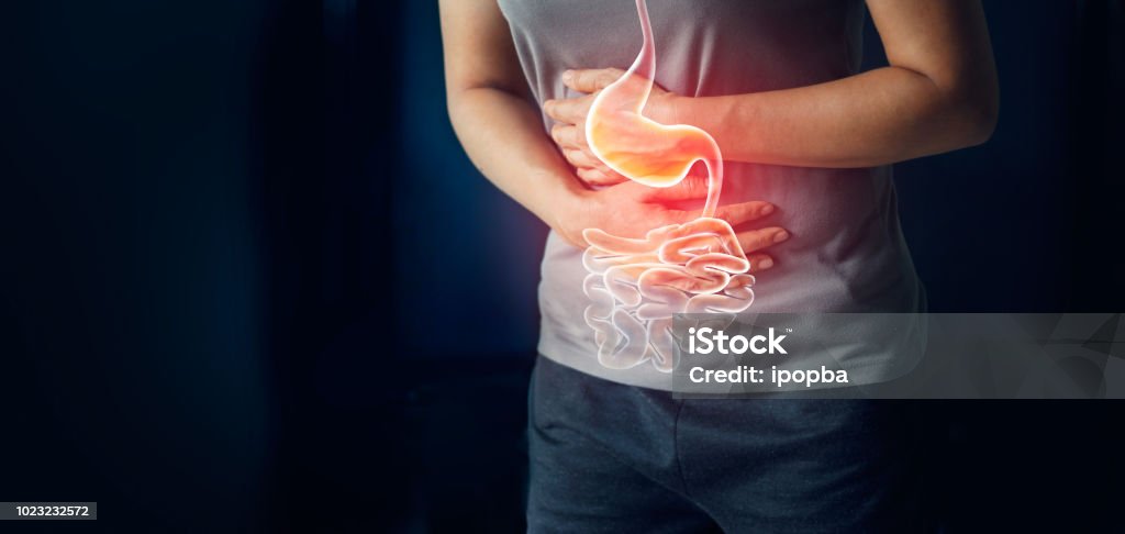 Woman touching stomach painful suffering from stomachache causes of menstruation period, gastric ulcer, appendicitis or gastrointestinal system disease. Healthcare and health insurance concept Stomachache Stock Photo