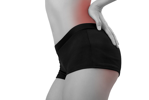 woman holding her beautiful healthy body with massaging back and hip in pain area black and white color with red highlighted, Isolated on white background.