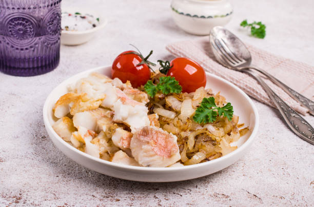 istock Slices of fried fish with vegetables 1023250916