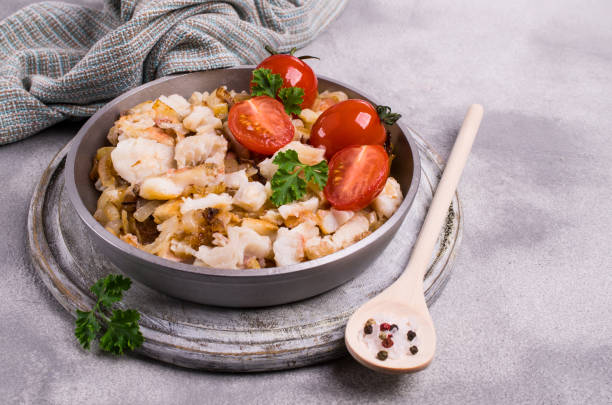istock Slices of fried fish with vegetables 1023260350