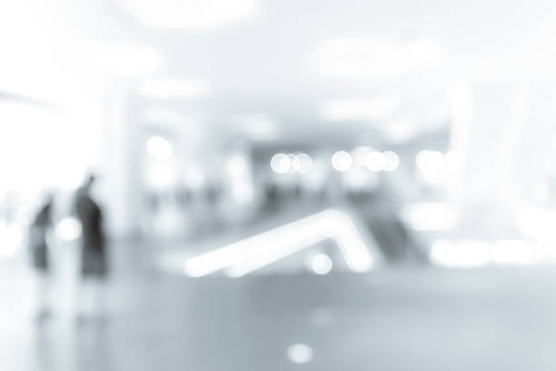 istock blur shopping mall background with B&W color 1023277440