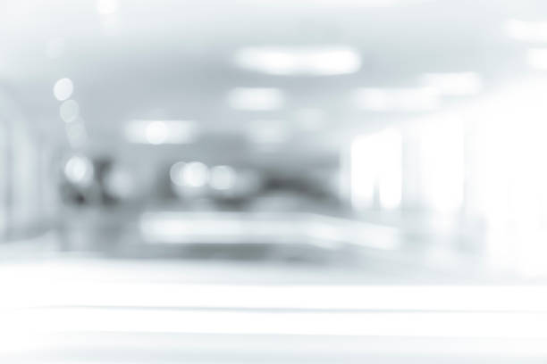 istock blur shopping mall background with B&W color 1023277446