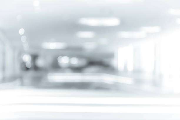 istock blur shopping mall background with B&W color 1023277450