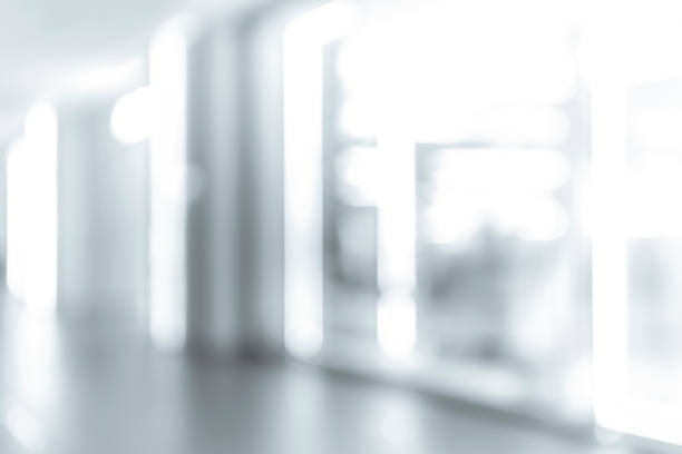 istock blur shopping mall background with B&W color 1023277454