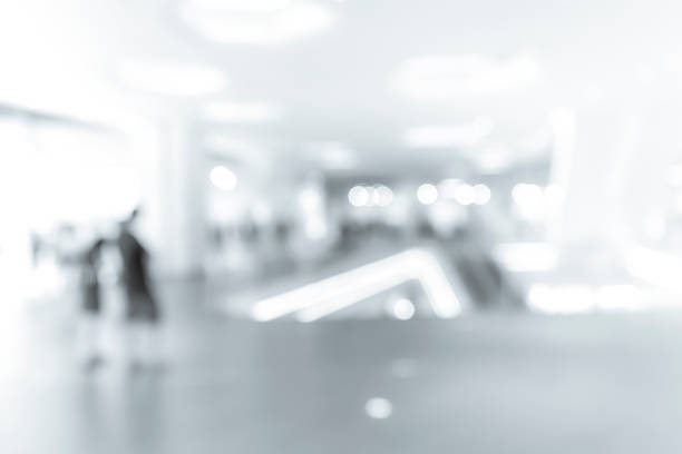 istock blur shopping mall background with B&W color 1023277462