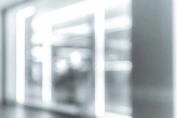 istock blur shopping mall background with B&W color 1023277464