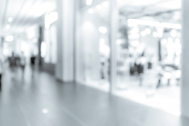 istock blur shopping mall background with B&W color 1023277502