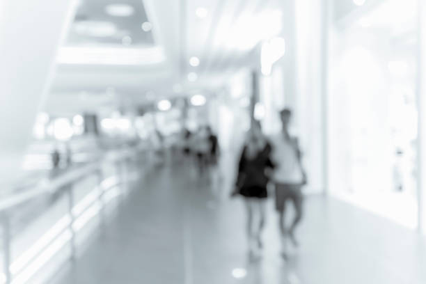 istock blur shopping mall background with B&W color 1023277516