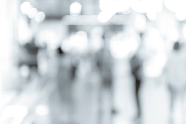 istock blur shopping mall background with B&W color 1023277530