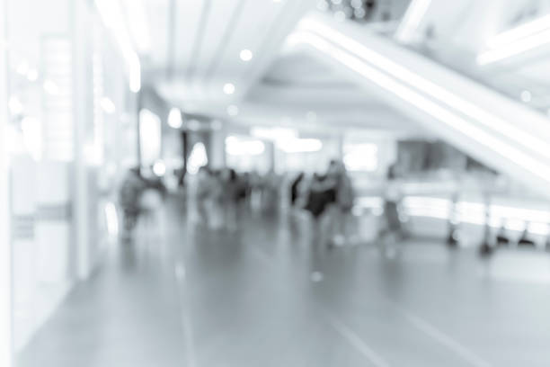 istock blur shopping mall background with B&W color 1023277534