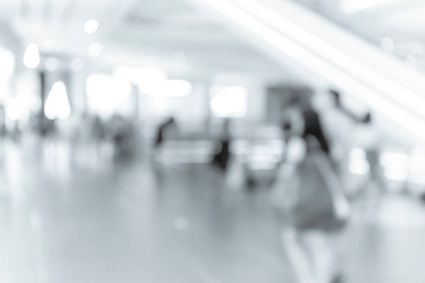 istock blur shopping mall background with B&W color 1023277550