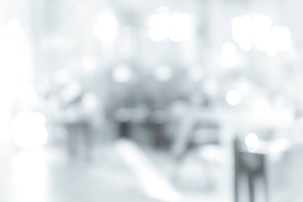 istock blur shopping mall background with B&W color 1023277600
