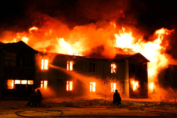 istock Burning wooden house 1023280718